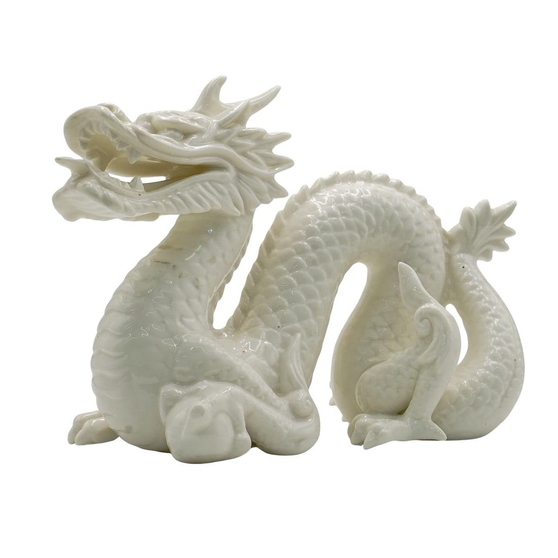 Vintage Chinese Blanc De Chine Dragon: Vintage Chinese Blanc De Chine Dragon 20th Cent., China A vintage porcelain dragon crafted in a blanc de chine design, completed with a glazed finish. H: 6" W: 8"