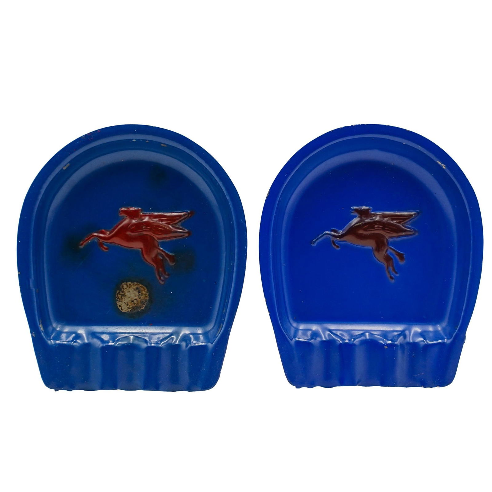 Pair Of Mobile Pegasus Metal Ashtrays: Pair Of Mobile Pegasus Metal Ashtrays1940, USAThe Pegasus metal ashtray features a blue base with a red Pegasus logo, the iconic winged horse, in the center. The ashtray is made of metal and has a hor