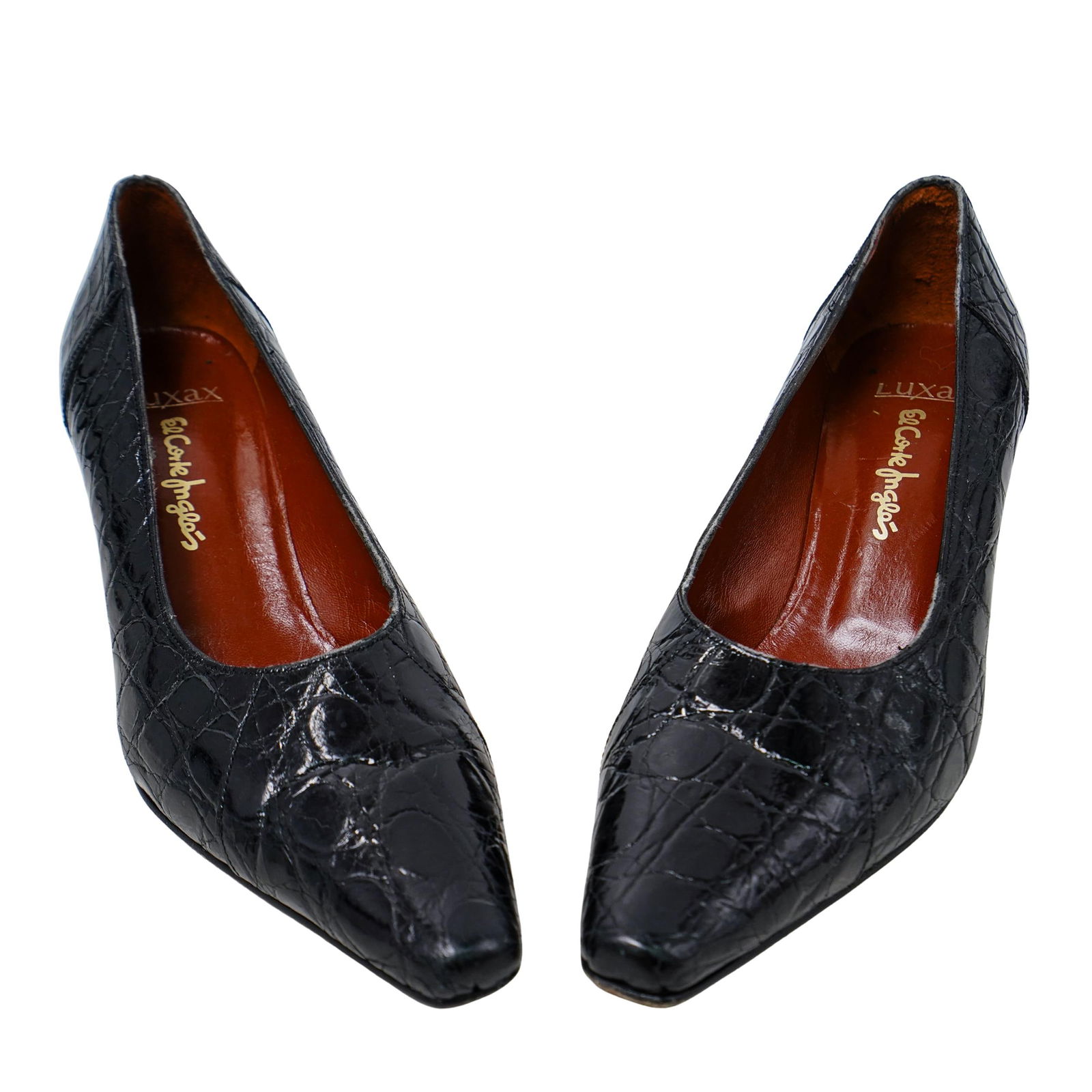 Luxax Crocodile Heels: Luxax Crocodile Heels20th century, SpainLuxax black crocodile heels with brown leather insoles. Insoles marked "Luxax El Corte Ingles" in gilt text. Outersoles sized 38 and marked "Luxax Suela Cuero m