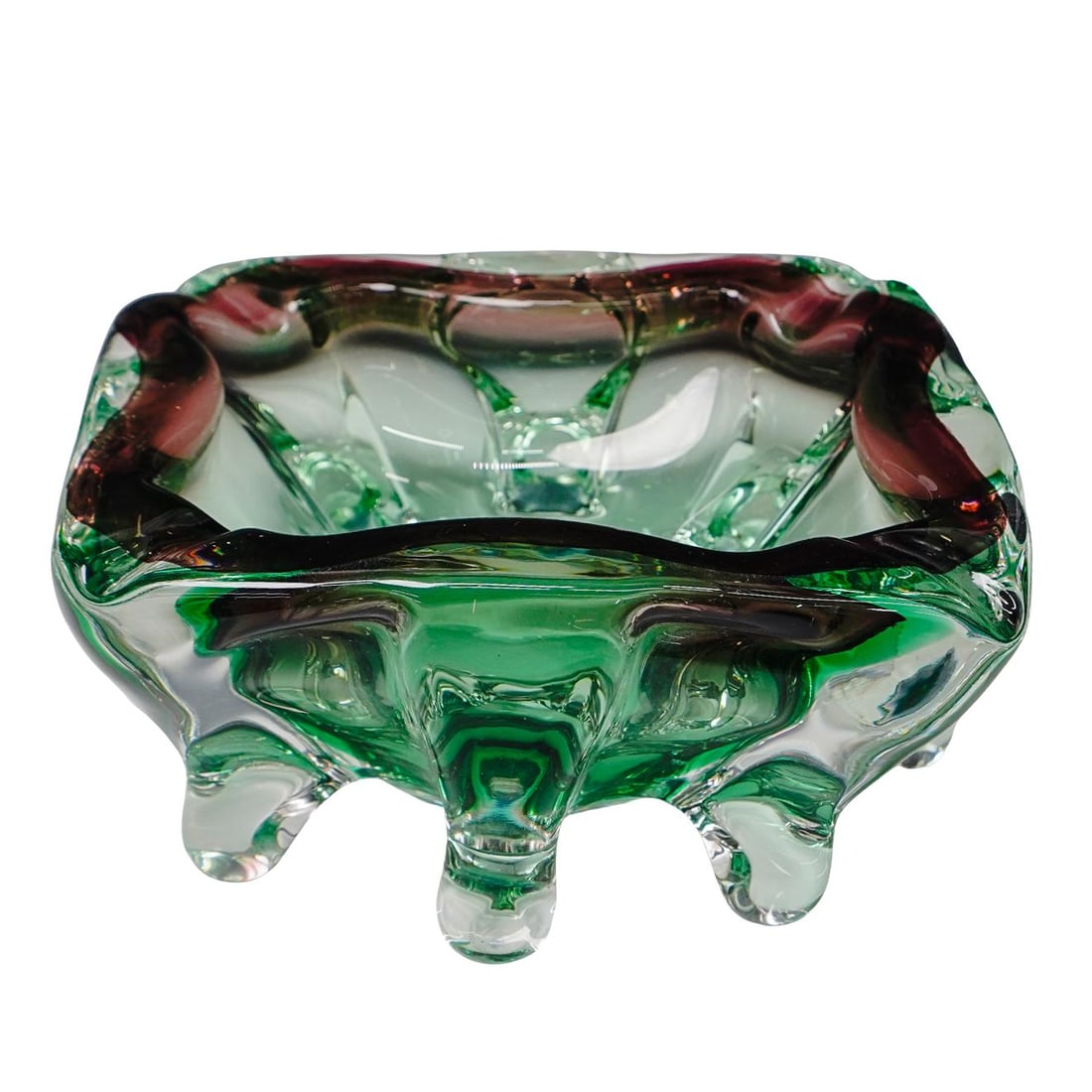 Abstract Murano Glass Ashtray: Abstract Murano Glass Ashtray Mid to late 20th century, Continental Green and purple abstract art ashtray. Four divots to rest cigarillos or cigarettes. Footed on all sides. H 3 1/4" W 6" L 7 1/8"