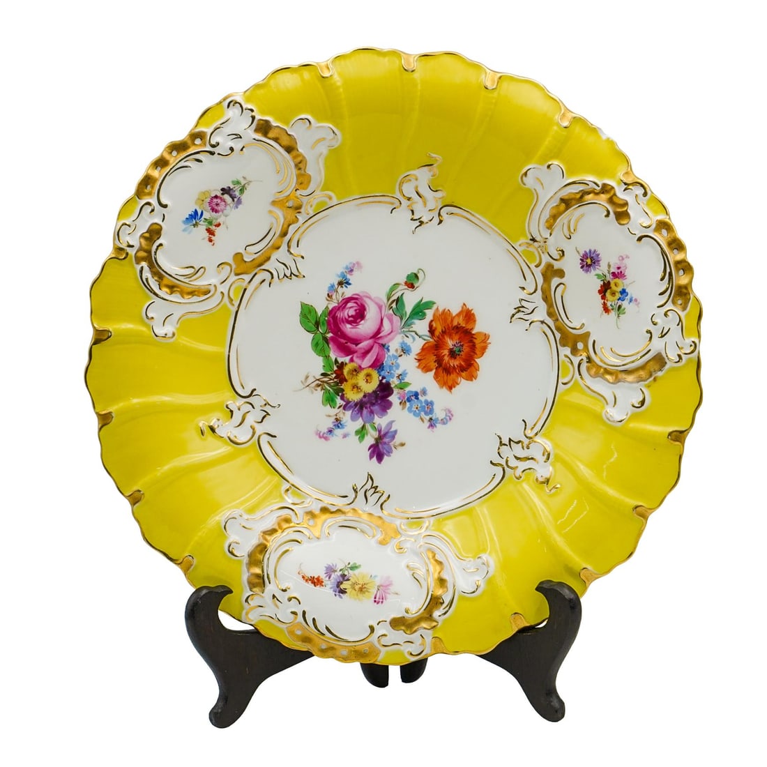 Vintage Meissen Porcelain Plate: Vintage Meissen Porcelain Plate20th century, GermanyA Meissen porcelain plate with a bright yellow background and elaborate floral decorations. The center of the plate features a bouquet of flowers. A