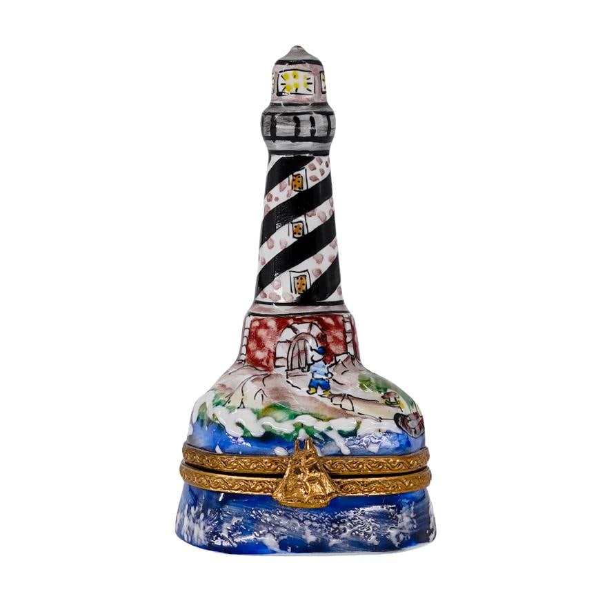 Limoges Porcelain Light Tower Trinket Box: Limoges Porcelain Light Tower Trinket Box20th Cent, FranceLimoges porcelain trinket box features in the form of a light tower, hand painted with brass closure and accompanied with life saver trinket p