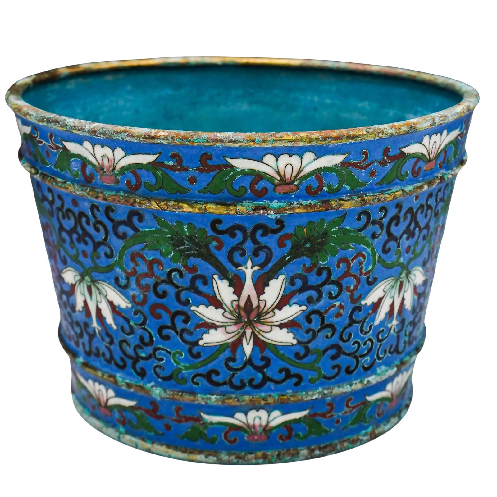 Chinese Cloisonne Enameled Jardiniere: Chinese Cloisonne Enameled JardiniereEarly to mid 20th century, ChinaChinese cloisonne enameled jardinere in blue with white lotus motifs and floral patterned accents. Gilt border.H 4 3/4" Diameter 6