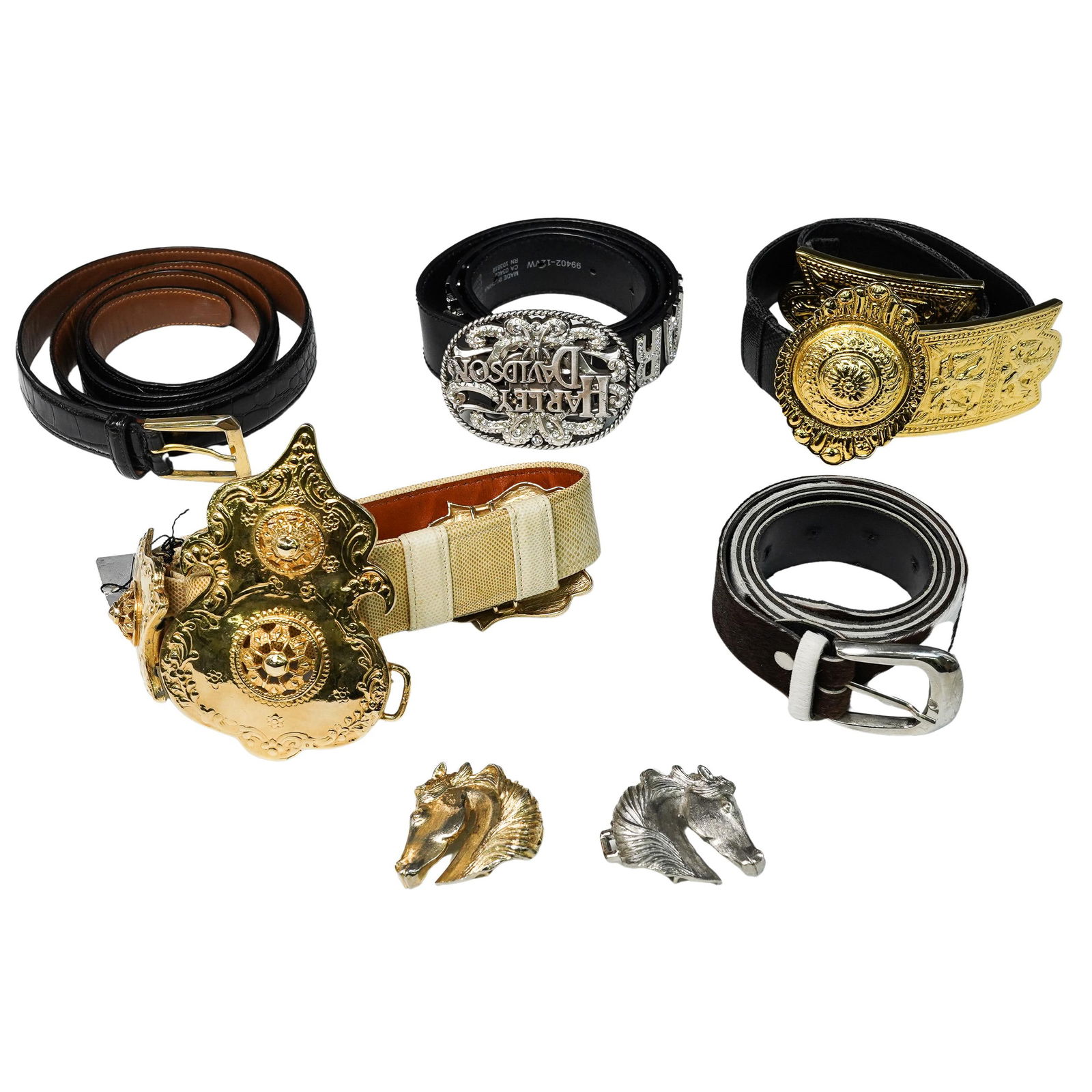 (8 Pcs) Vintage Belt and Buckle Collection: (8 Pcs) Vintage Belt and Buckle Collection20th century, USA/ EuropeThis collection includes:1. Black belt with a silver and rhinestone buckle. It is made from genuine cowhide leather. The belt feature