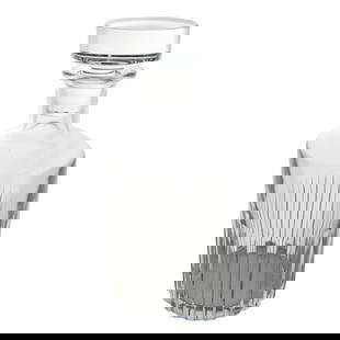 Baccarat Crystal Decanter: Baccarat Crystal Decanter20th Century, FranceBaccarat Crystal Decanter, crafted in fine French crystal with vertical cuts and a matching faceted stopper. The decanter showcases Baccarat’s signature