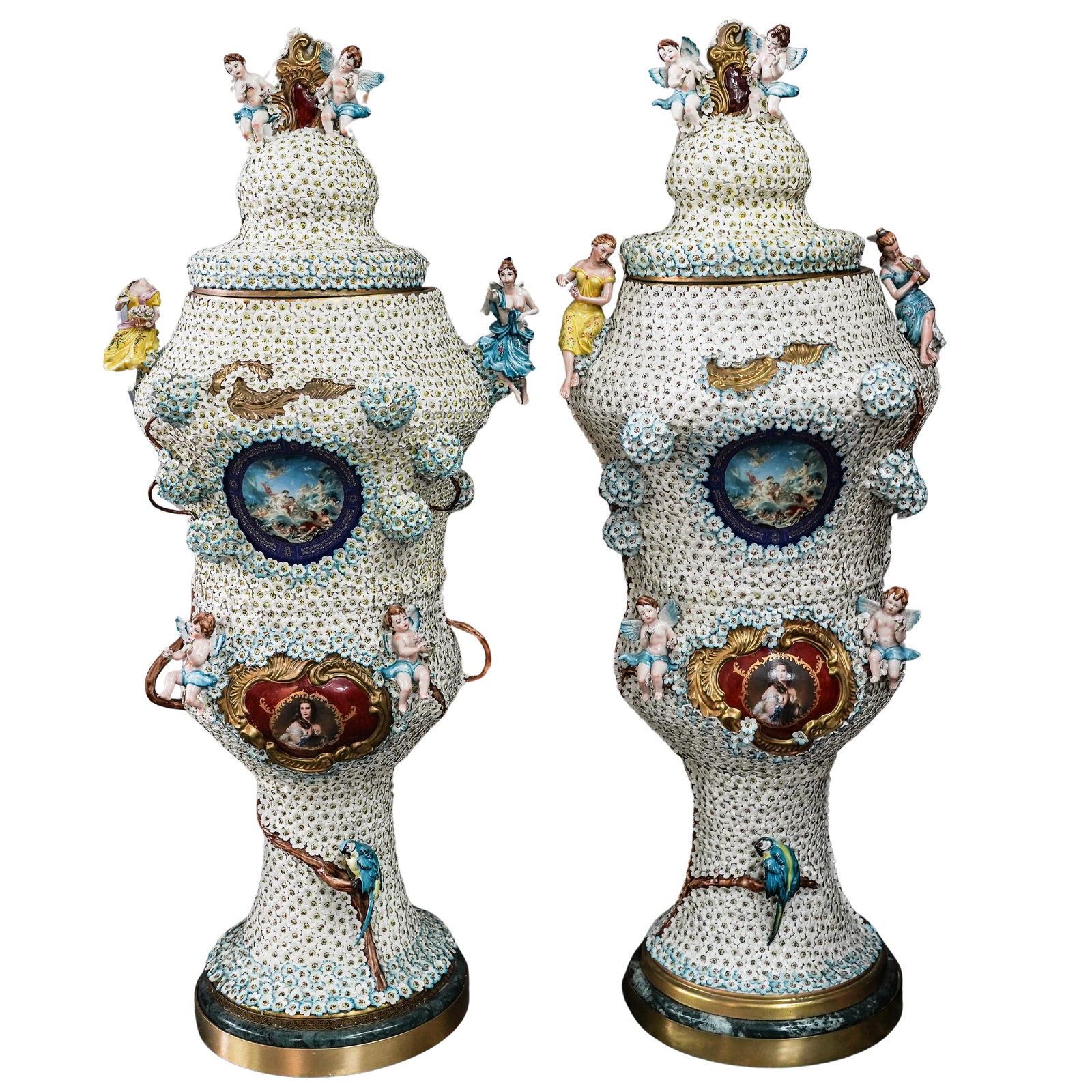 Pair Of Monumental Dresden Style Porcelain Urns: Pair Of Monumental Dresden Style Porcelain UrnsLate 19th to Early 20th Century, GermanyPair of monumental Dresden style porcelain urns, each is a pedestal urn with a domed lid and adorned with classic