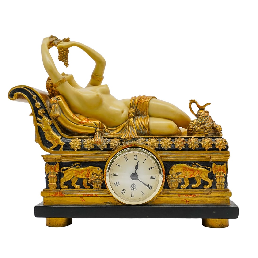 "Taranis" Art Deco Female Nude Figural Mantle Clock: "Taranis" Art Deco Female Nude Figural Mantle Clock1930s-1940s, ContinentalArt Deco figural mantle clock in a resin construction depicting a female figure reclining on a classically decorated chaise h