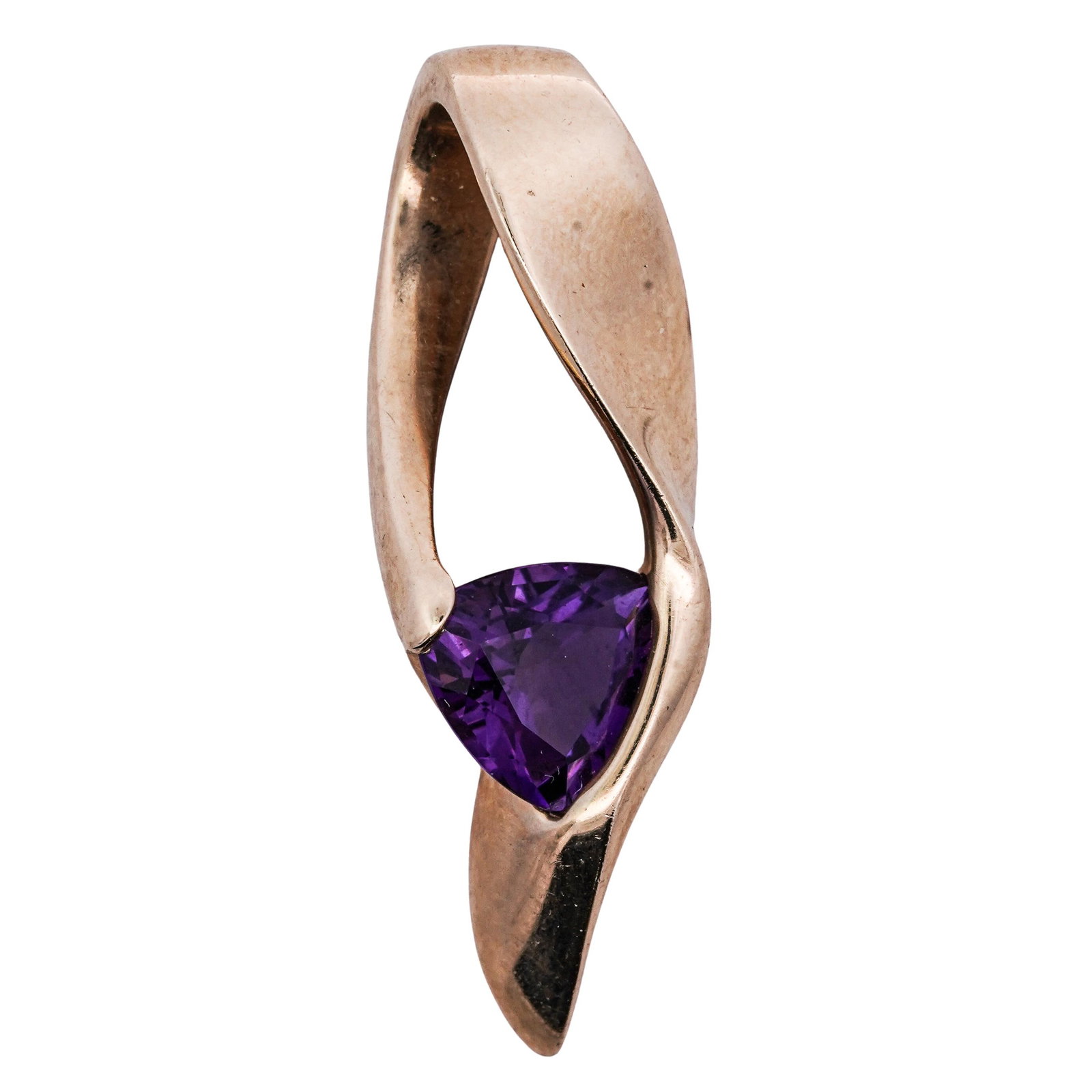 Contemporary 14k Gold and Amethyst Pendant: Contemporary 14k Gold and Amethyst Pendant 21st Century, Continental Contemporary 14k gold pendant, featuring a fluid design centered around a deep purple trillion cut amethyst stone. Hallmarked "14K"