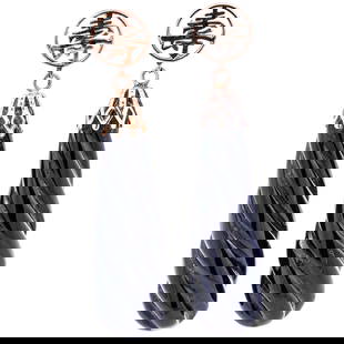 Chinese 14k Gold and Black Onyx Drop Earrings: Chinese 14k Gold and Black Onyx Drop Earrings20th Century, ChinaPair of Chinese 14k gold earrings, featuring bold, carved black onyx drops in a twisted, spiral design. At the top of each earring is a