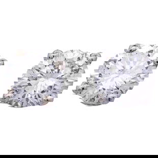 14k White Gold and Diamond Stud Earrings: 14k White Gold and Diamond Stud Earrings21st Century, ContinentalPair of 14k white gold stud earrings, each featuring a round cut diamond (approx. 0.4 carats total) held securely in place by a prong s