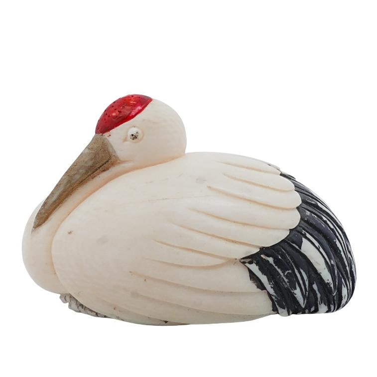Antique Japanese Carved Stork Netsuke: Antique Japanese Carved Stork NetsukeEarly 20th Cent, JapanA Japanese hand carved Netsuke, featuring a stork, composed of bone. Character markings on bottom.H:1.25" x W:1" x L: 2"
