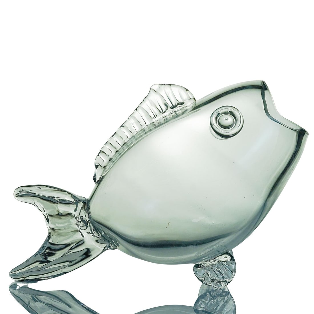 Vintage Art Glass Fish Bowl: Vintage Art Glass Fish BowlMid-20th century, ContinentalA clear glass fish-shaped vase made of hand-blown glass. It has a wide mouth opening and a tail and fins that help it stand upright.H: 9 1/2" W: