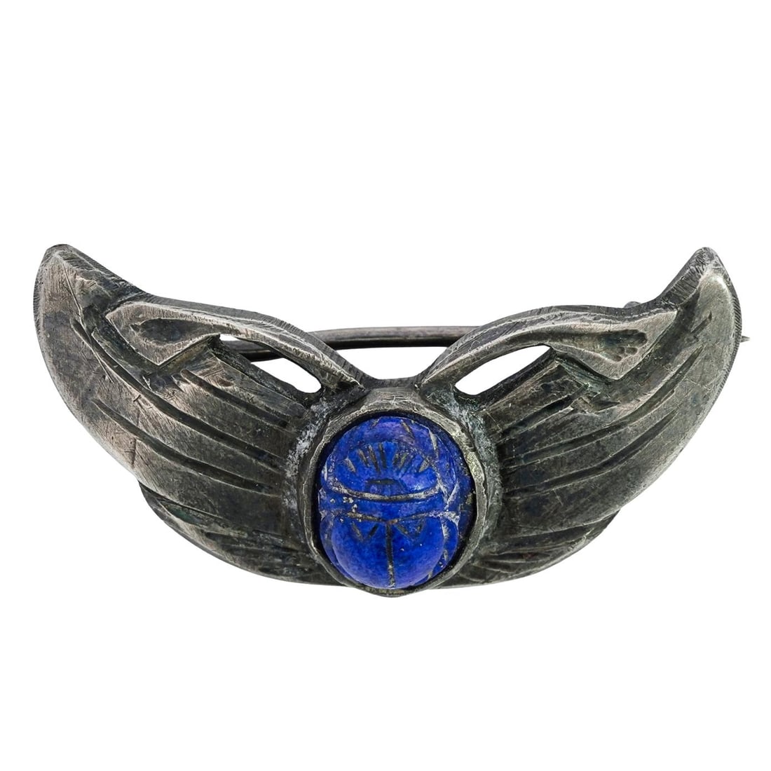 Antique Sterling Silver Scarab Brooch: Antique Sterling Silver Scarab Brooch 20th Century, Europe This antique brooch features a winged scarab motif in sterling silver, centered with a deep blue cabochon. Inspired by ancient Egyptian symbo