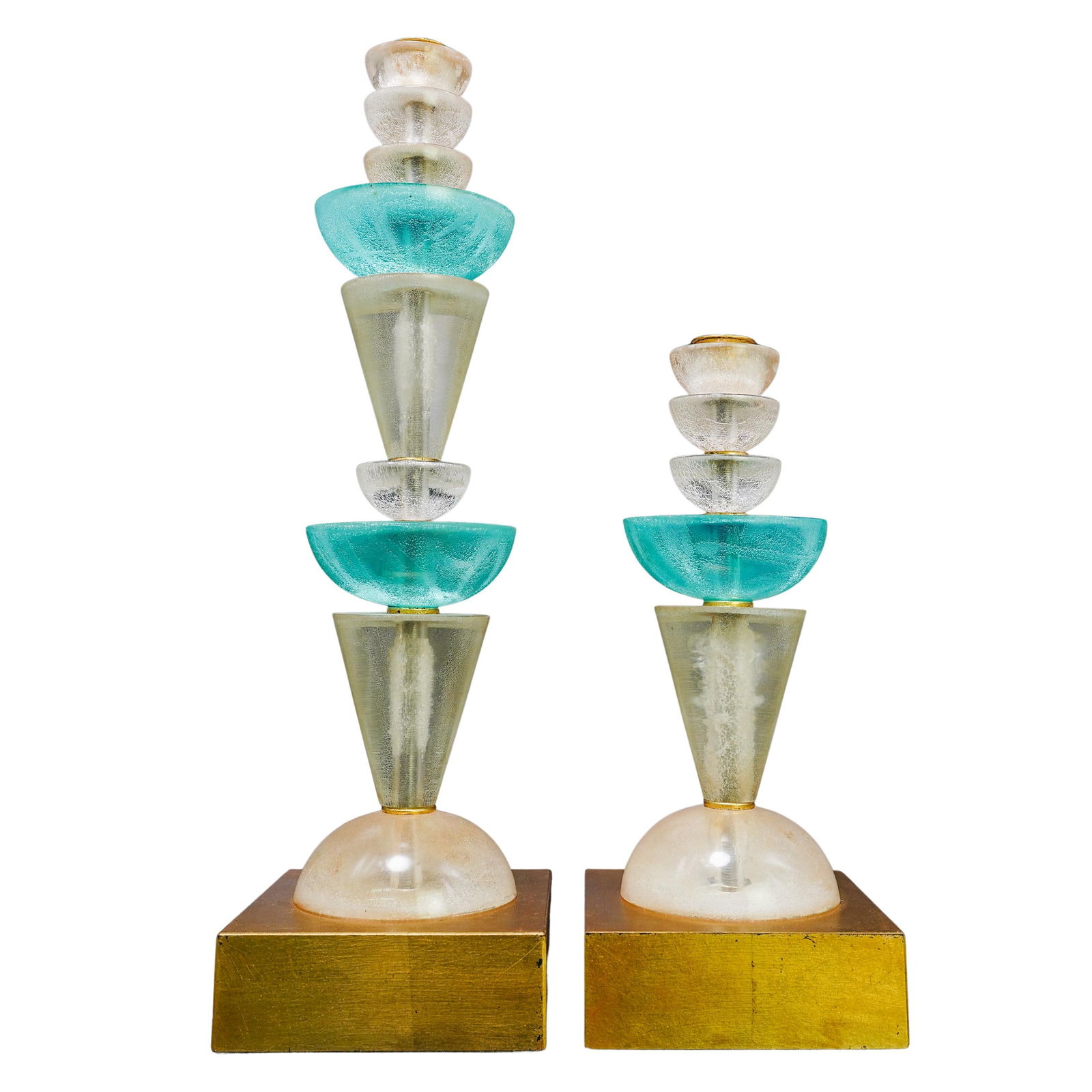 Pair of Van Teal Lucite Candlesticks: Pair of Van Teal Lucite CandlesticksMid-20th century, USATwo candlesticks with a geometric, layered design. Each piece has a gold-tone square base and a vertically stacked arrangement of translucent l