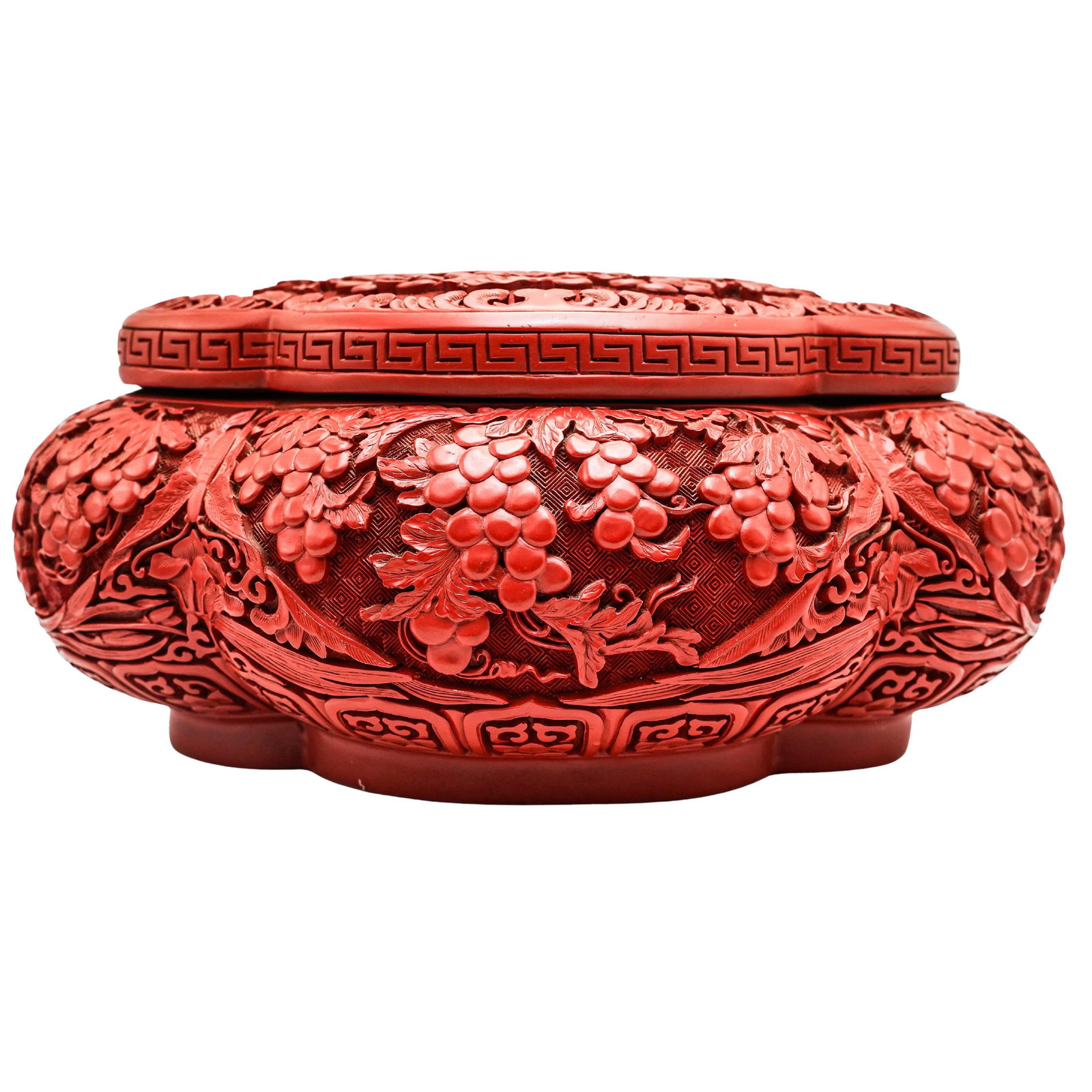 Ornate Carved Cinnabar Lacquer Box: Ornate Carved Cinnabar Lacquer BoxLate 20th c., ChinaFaux cinnabar box with detailed carvings of grapes and a lacquer interior.11.25"L x 7"W x 5"H