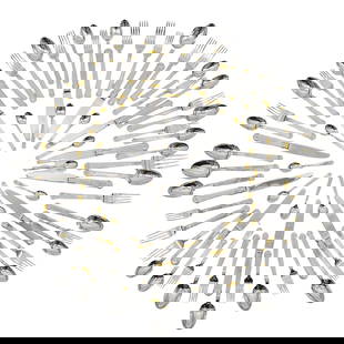 (74 Pc) Christian Dior "Gaudron" Flatware Set: (74 Pc) Christian Dior "Gaudron" Flatware Set1991-1999, Japan(74 Pc) Christian Dior flatware set in the "Gaudron" pattern, in stainless steel with ribbed design and gold tone accents. Pattern disconti