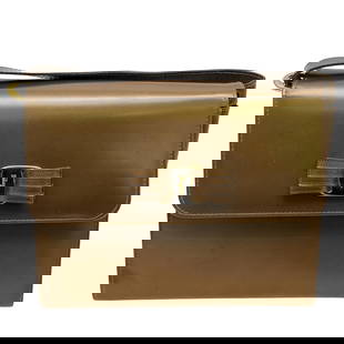 Salvatore Ferragamo Shoulder Bag: Salvatore Ferragamo Shoulder Bag20th century, ItalySalvatore Ferragamo shoulder bag in gold metallic color, featuring a sleek rectangular shape with a decorative bow closure marked "Ferragamo." Inside