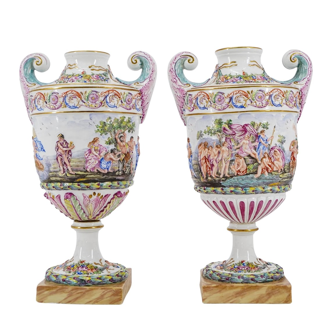 (2 Pcs) Italian Neoclassical Porcelain Vases: (2 Pcs) Italian Neoclassical Porcelain Vases20th century, EuropeCapodimonte style vases features a wide opening, double-scroll handles, and rests on a square faux-marble base. The bodies are hand-pain
