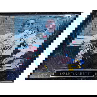 NASCAR Dale Jarrett Signed Plaque: NASCAR Dale Jarrett Signed PlaqueLate 20th c., USALaminated wood plaque with an autographed photo of NASCAR driver, Dale Jarrett.10.5"L x 13"W