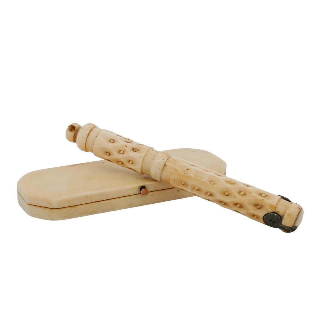 Pair of Victorian Carved Bone Sewing Accessories: Pair of Victorian Carved Bone Sewing Accessories19th Century, FrancePair of Victorian era sewing accessories, including a carved bone needle case with a geometric pattern across the outer surface. It