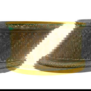 Attrib. to Gorham Antique Bronze Ashtray: Attrib. to Gorham Antique Bronze AshtrayLate 19th to early 20th century, EuropeThis bronze cylindrical object features a wide, open top rim and a base with a patterned edge. The body is adorned with d
