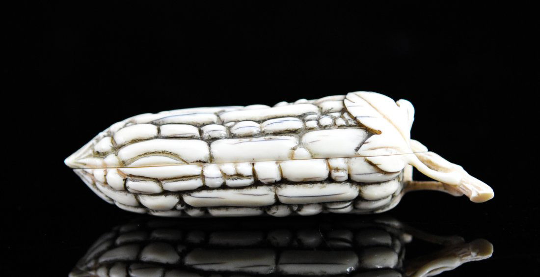 Antique Chinese hidden erotic ivory carving: DESCRIPTION: Antique Chinese hidden erotic ivory carving. A large ivory elongated fruit which opens up revealing a hidden erotic carving of two lovers in the act of love making. The other side of the