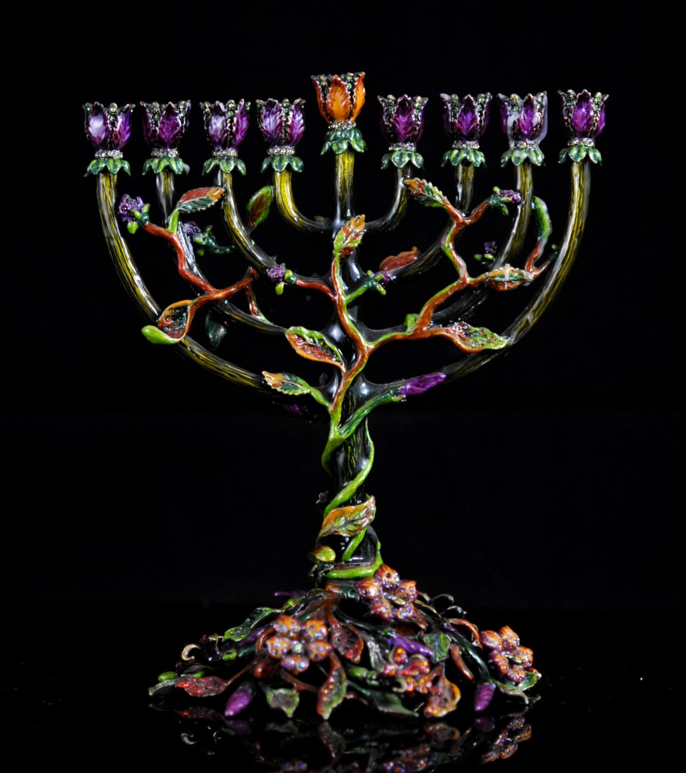 Jay Strongwater enamel and Swarovski crystal menorah: DESCRIPTION: Jay Strongwater enamel and swarovski crystal menorah. Very ornate menorah featuring a central foliate and floral motif. Entire piece is made from metal with a multi colored enamel overlay