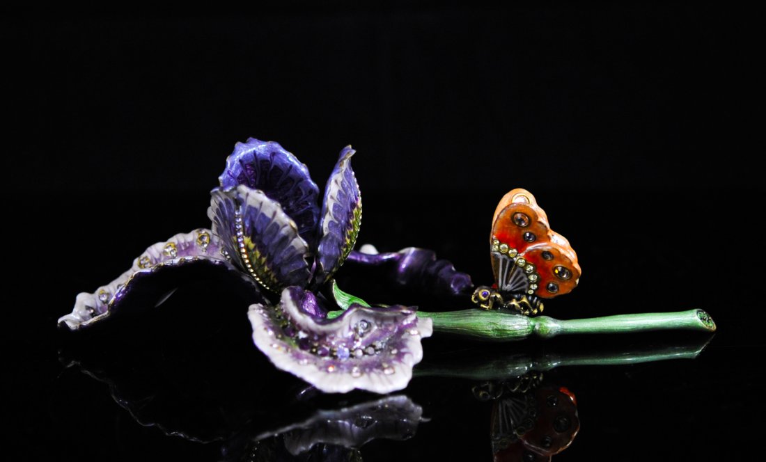 Jay Strongwater enamel and Swarovski crystal flower: DESCRIPTION: Jay Strongwater enamel and Swarovski crystal flower. Gorgeous violet tulip flower with abstract pedals. Features a mandarin orange butterfly perched on the stem with it's wings half open.