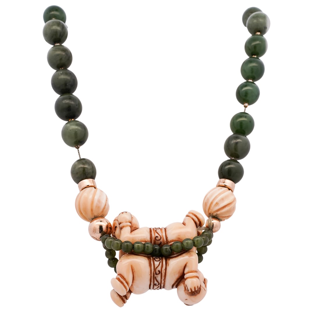 Chinese Beaded Jade Necklace with 14k Gold Accents and Carved Bone Beading: Chinese Beaded Jade & Bone Necklace with 14k Gold AccentsEarly to mid 20th century, ChinaChinese beaded jade necklace with 14k gold accent beading an a two sided carved bone figural beading in center.