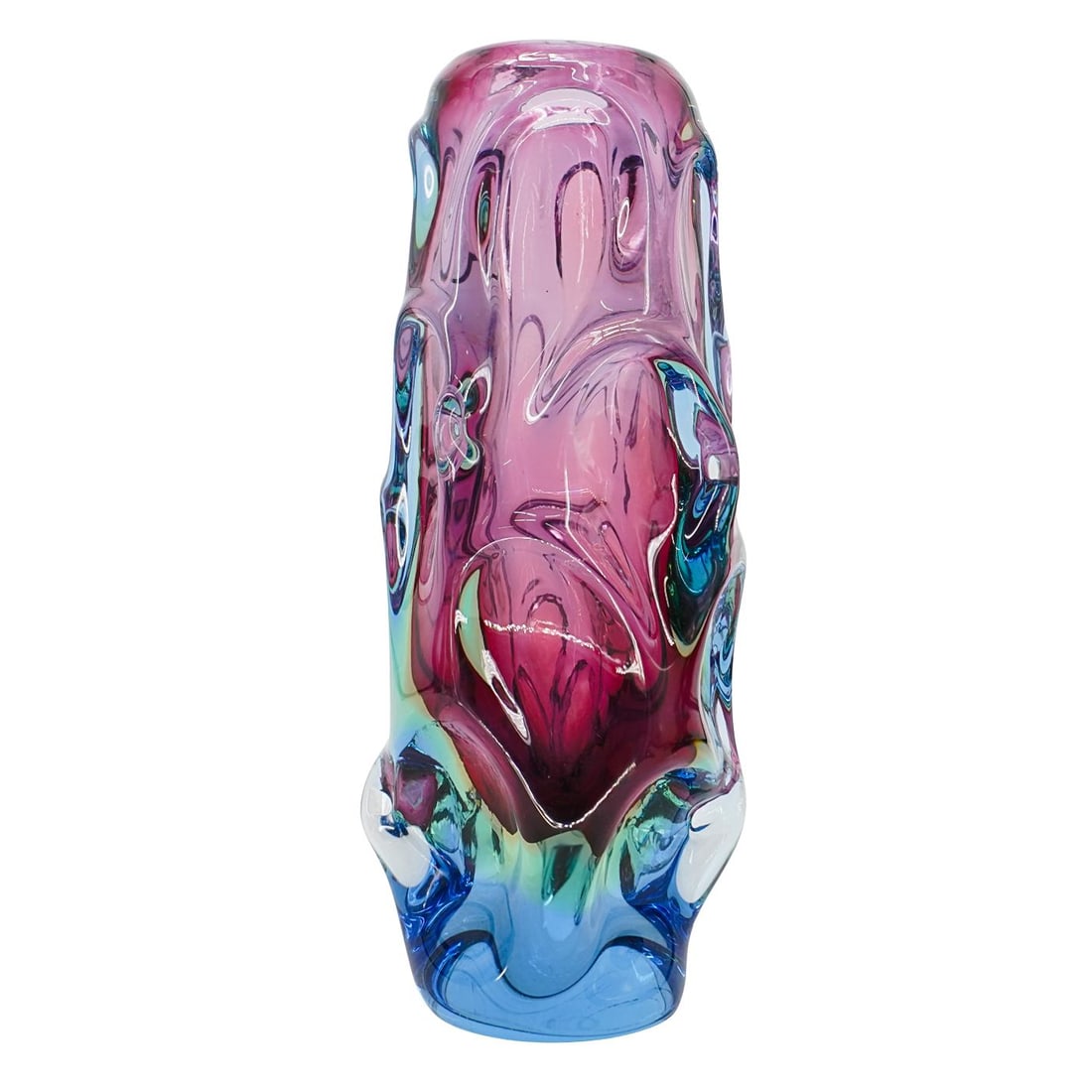 Skrdlovice Textured Art Glass Vase: Skrdlovice Textured Art Glass Vase 20th century, Czech Republic Tall, sculptural vase with a deep amethyst core and thick, clear glass casing that transitions into blue at the base. The surface featur