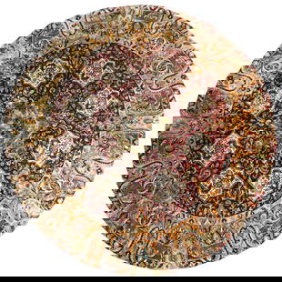 Large Wool Circular Area Rug: Large Wool Circular Area RugEarly 20th Century, ContinentalA circular wool threaded area rug in an ornate floral design in burnt yellow, light blue, and red.Diameter: 146 1/2"