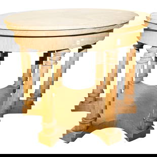 Round Wooden Table: Round Wooden TableEarly to mid 20th century, ContinentalRound wooden table. Carved pillar legs. Light brown wood.H 30" Diameter (top) 37 34" Diameter (base) 34"