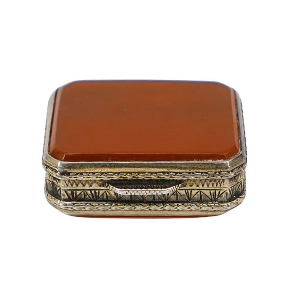 Antique Double Sided Carnelian & Silver Mini Pill Box: Antique Double Sided Carnelian & Silver Mini Pill BoxLate 19th - Early 20th c., EuropeanMiniature ornately etched silver box with a smooth bezel set carnelian lid and bottom. Stamped 850 with an illeg