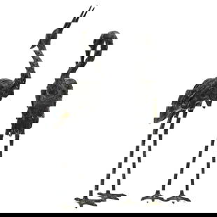 Pair of Large Bronze Heron Sculptures: Pair of Large Bronze Heron Sculptures20th century, ContinentalA pair of large, dark bronze heron sculptures with elongated legs and gracefully curved necks. One heron gazes upward, while the other ben