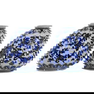 Pair of Chinese Blue And White Porcelain Vases: Pair of Chinese Blue And White Porcelain Vases20th century, ChinaChinese Blue and white porcelain vase with floral and heart motifs, rounded body, narrow neck, and flared rim.H: 8 1/2" D: 2 1/2"