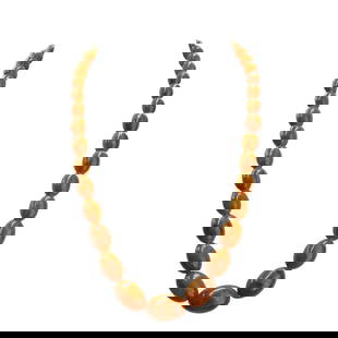 Antique Butterscotch Amber Beaded Necklace: Antique Butterscotch Amber Beaded NecklaceLate 19th-early 20th century, ContinentalLarge butterscotch amber strand beaded necklace with various sized beads. Brass clasp. Total weight: 78 grams.L (clas