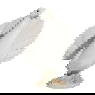 Lladro Porcelain Dove Figurine: Lladro Porcelain Dove Figurine20th Century, SpainLLadro Porcelain Dove Figurine. Depicting a standing dove bird, in white glazed porcelain. Model 1016. Marked with Lladro stamp on the underside.H: 8"