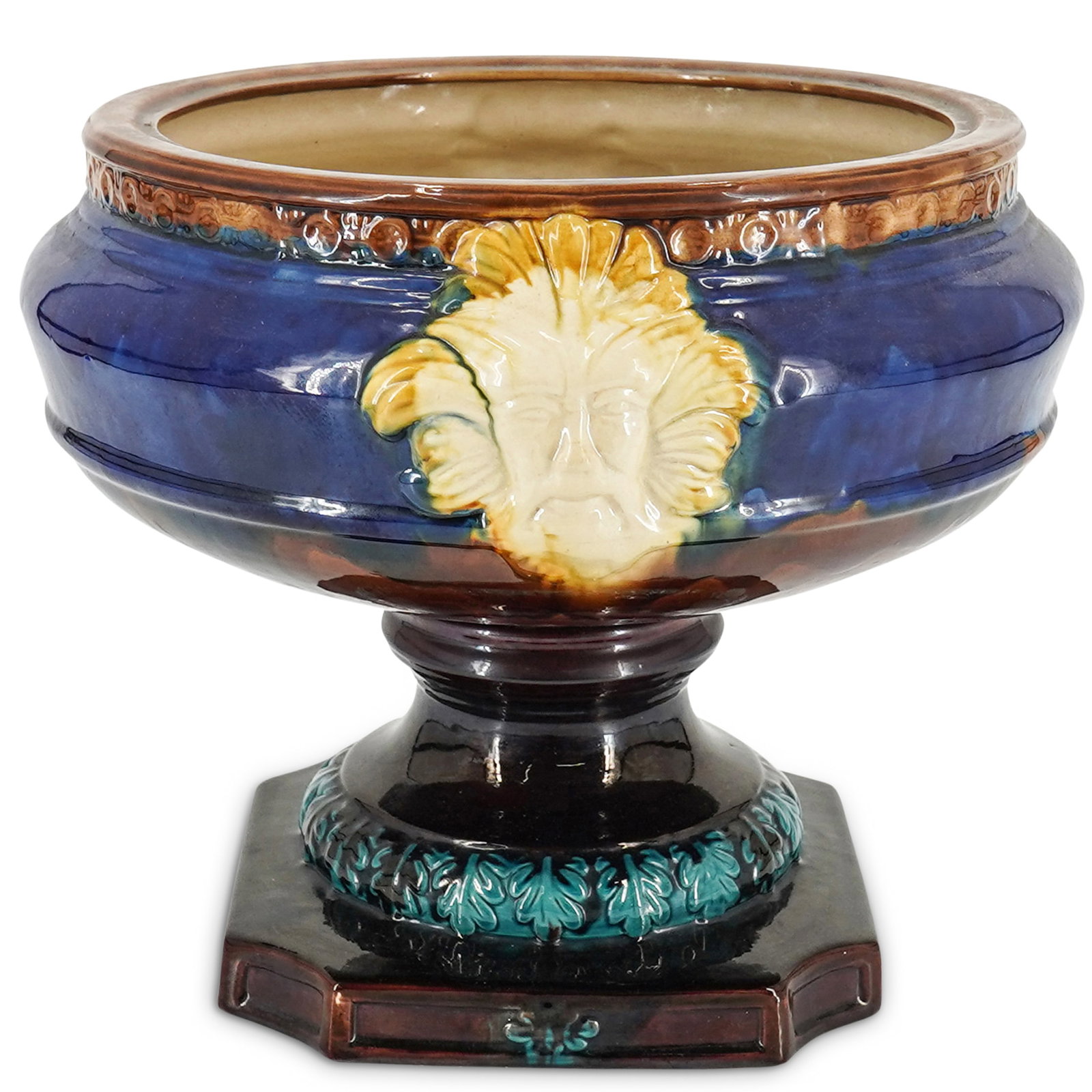 Large Cobalt Blue Majolica Jardiniere: Large Cobalt Blue Majolica Jardiniere 20th century, European Porcelain jardiniere coated in a variously toned majolica glaze and featuring a green man face in relief on either side of its body and a f