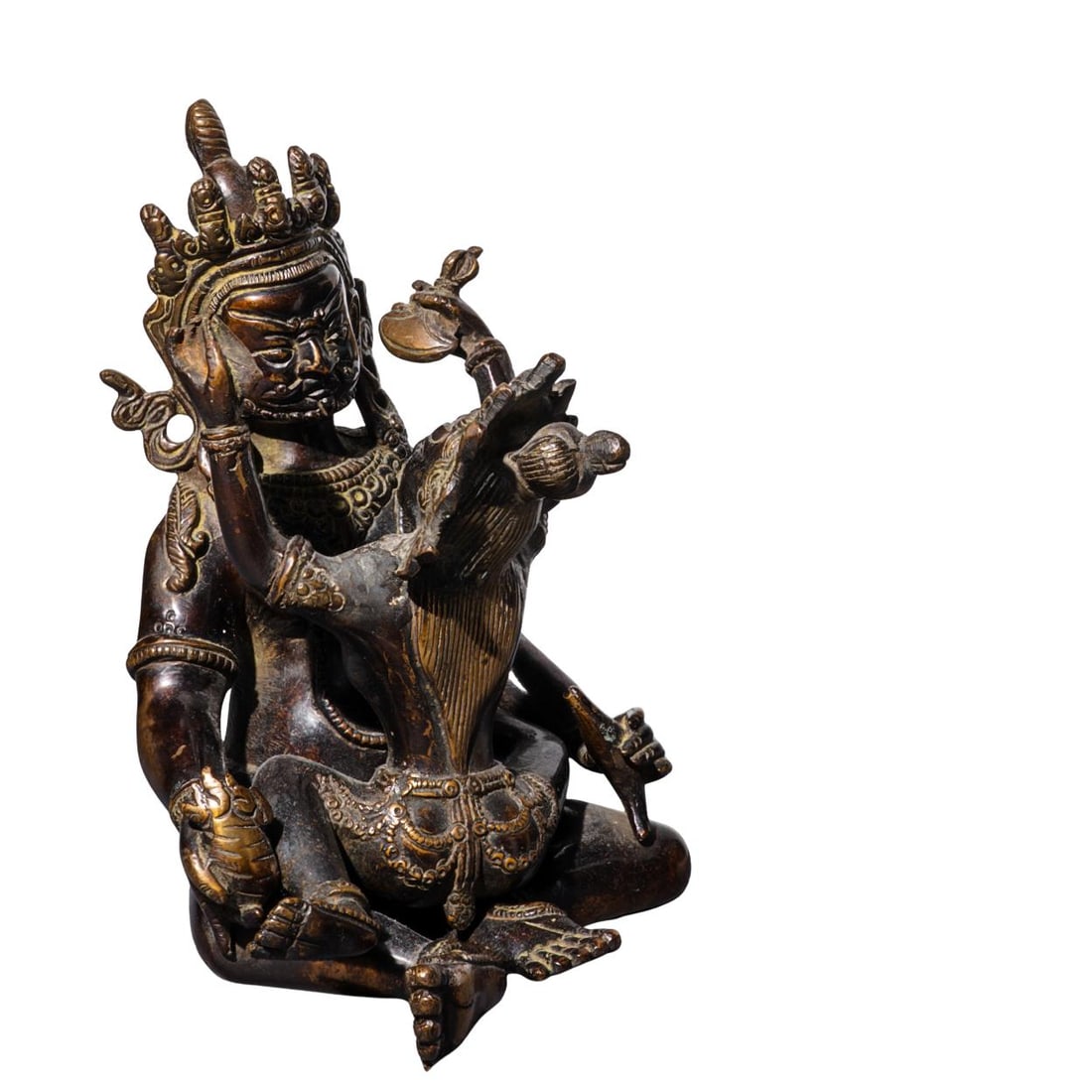 Antique Tibetan Bronze Yab-Yum Sculpture: Antique Tibetan Bronze Yab-Yum SculptureLate 19th to early 20th century, TibetA bronze statuette depicting a Buddhist divine couple in an intimate pose, known as Yab-Yum. Both figures wear traditional