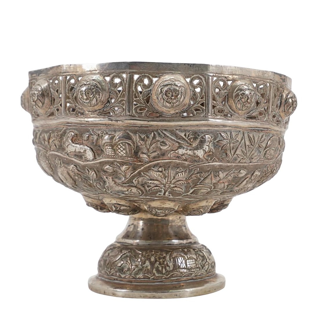 Antique Sterling Silver Burmese Bowl: Antique Sterling Silver Burmese Bowl Late 19th century, Myanmar Burmese sterling silver bowl with repousse designs throughout featuring open cut florals, lion motifs, and a village motif around bowl c