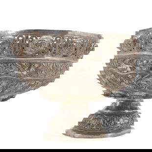 Antique Sterling Silver Burmese Bowl: Antique Sterling Silver Burmese BowlLate 19th century, MyanmarBurmese sterling silver bowl with repousse designs throughout featuring open cut florals, lion motifs, and a village motif around bowl con