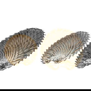 Pair of Sterling Silver Shell Dishes: Pair of Sterling Silver Shell DishesLate 19th-early 20th century, ContinentalPair of sterling silver shell dishes. Each dish is footed and has two hallmarks. One is a pictorial hallmark of a horned bu