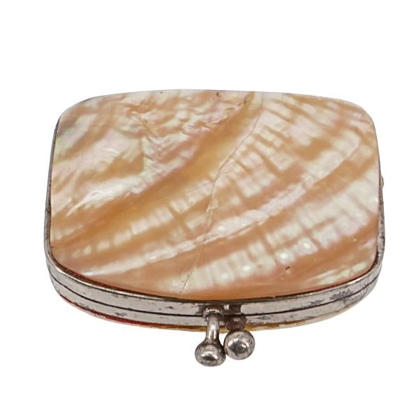 Antique Mother-of-Pearl Coin Wallet: Antique Mother-of-Pearl Coin WalletLate 19th-early 20th century, EuropeAntique mother-of-pearl coin wallet. Inner lining is a red silk.L 2 1/8" W 1 3/8"