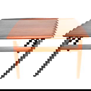 Danish Mid Century Modern Style Table: Danish Mid Century Modern Style Table20th Century, DenmarkDanish mid century modern style teak wood coffee or side table, featuring a square tabletop with a subtly raised edge, tapered cylindrical leg