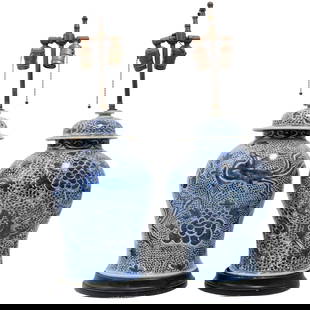Pair of Chinese Fenghuang Blue & White Porcelain Lamps: Pair of Chinese Fenghuang Blue & White Porcelain Lamps20th Century, ChinaTwo classic blue and white painted porcelain lamps featuring highly detailed mythical birds with flowers and mounted on dark wo