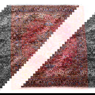 Persian Heriz Wool Area Rug: Persian Heriz Wool Area RugIran, early 20th centuryA Persian "Heriz" wool area rug featuring a dark red color scheme with ornate geometric floral patterns throughout in red, dark blue, pink, and light