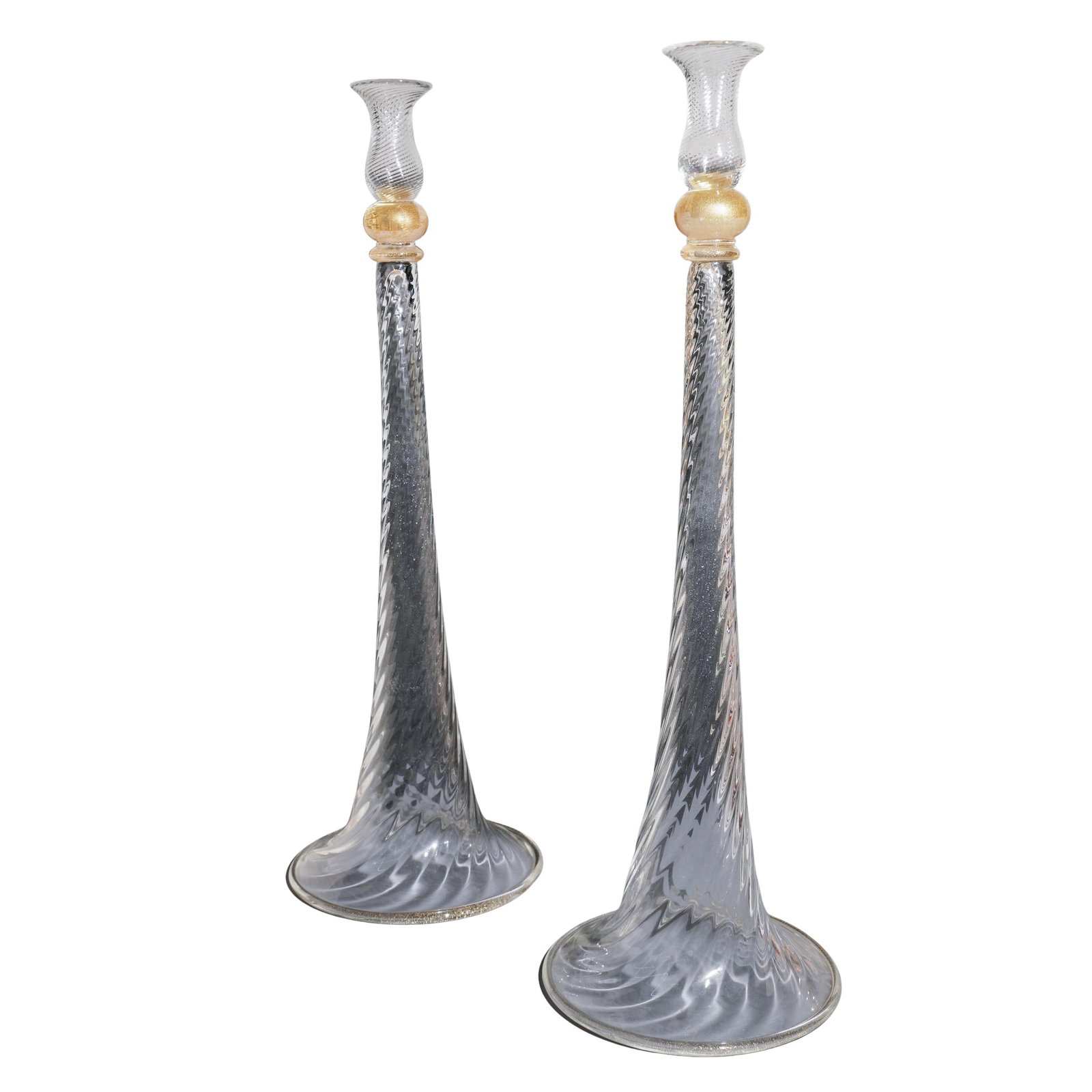 Pair of Signed Oversized Murano Candle Sticks: Pair of Signed Oversized Murano Candle Sticks 20th c., Italy Hand crafted tall twisted clear Murano glass graduated column candle sticks with gold flecks and bulbous tops. The artist signed at the bas