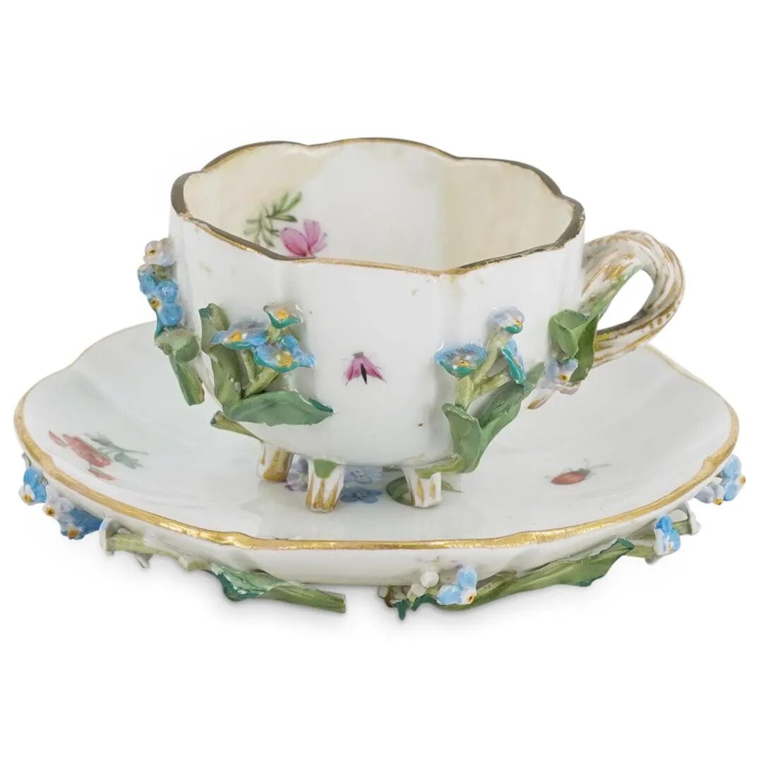 Antique Meissen Footed Teacup And Saucer: Antique Meissen Footed Teacup And Saucer 19th c. (possibly older), Germany Meissen teacup and saucer, each featuring six feet and applied floral and foliage designs and decorated with floral and insec