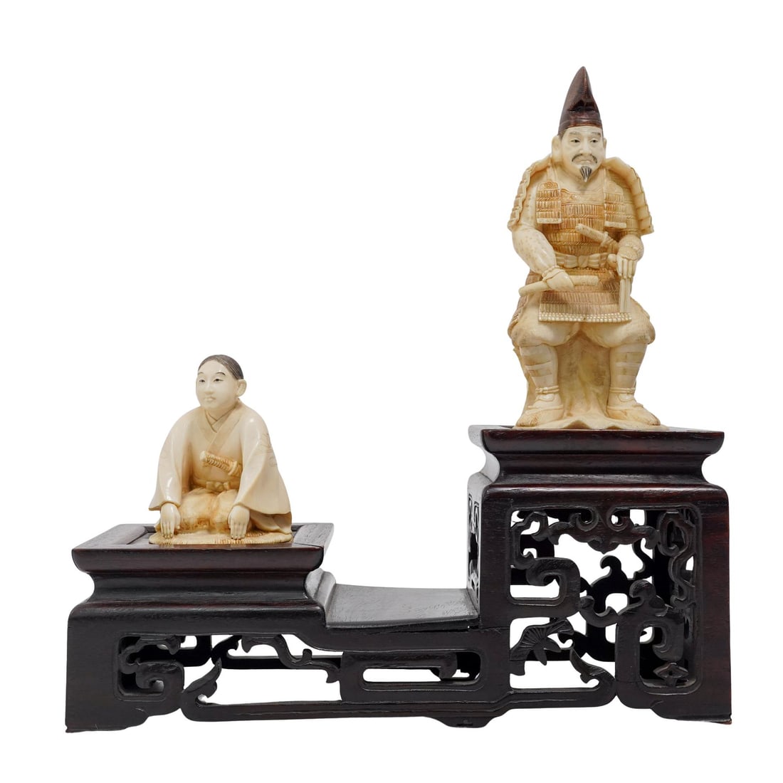 Japanese Carved Bone Okimono Samurai Figures on Stand: Japanese Carved Bone Okimono Samurai Figures on StandLate 19th-early 20th century, JapanCarved bone Japanese Samurai figures. Depicts a Samurai in full gear including the "hikitate-eboshi" in a darker