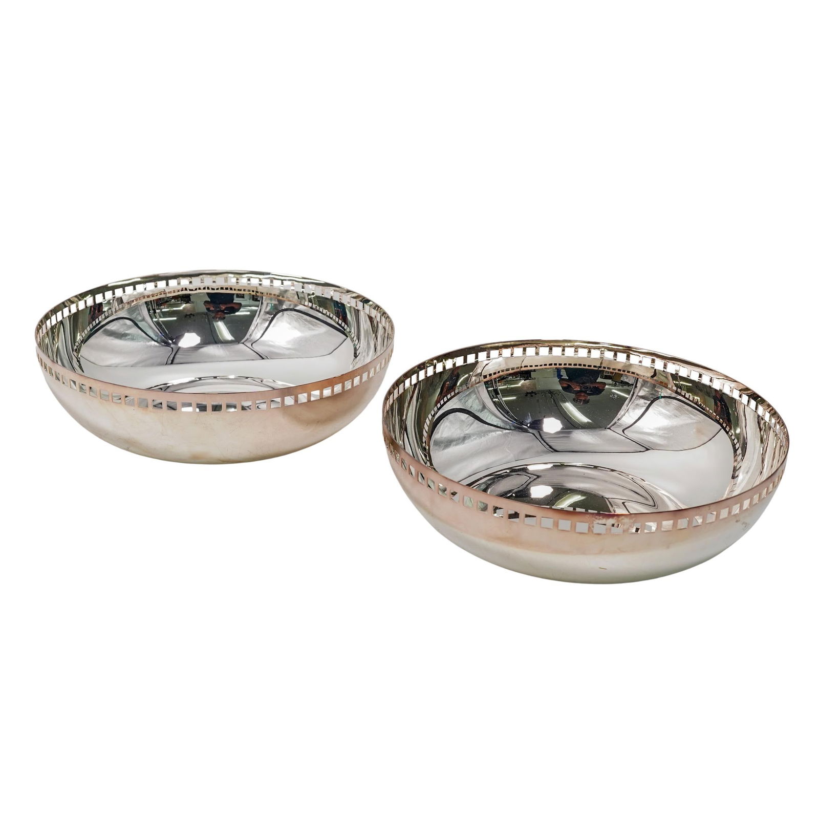 Pair of Silver Plated R Meier x Swid Powell Bowls: Pair of Silver Plated R Meier x Swid Powell BowlsMid to late 20th century, ItalyA pair of Swid Powell (established 1982) silver-plated bowls with open cut geometric border design. Designed by Richard